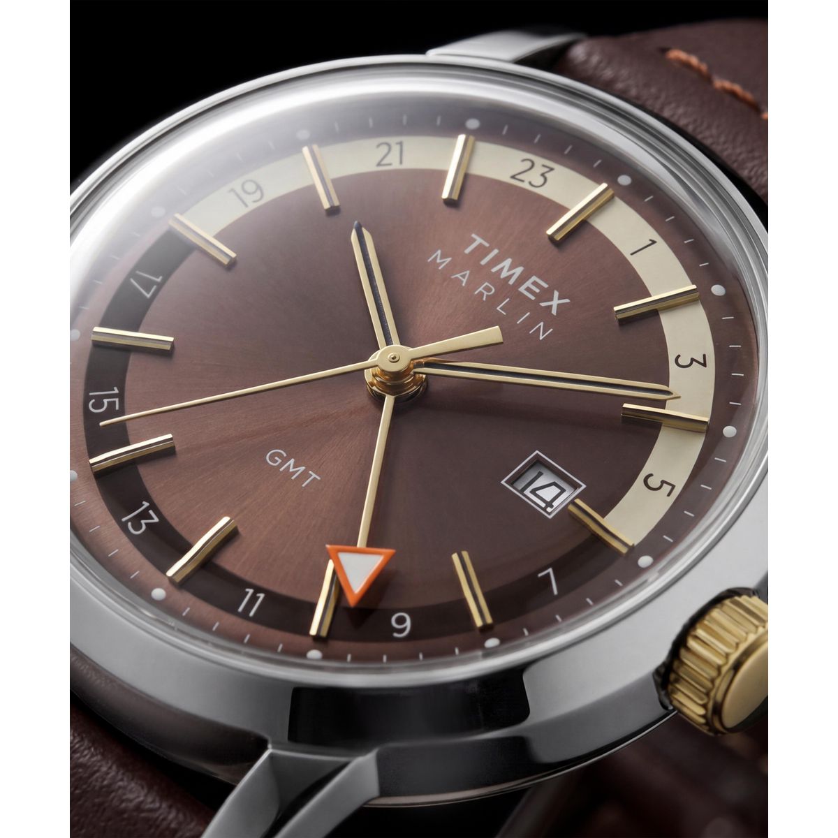 Close-up of the Timex Marlin GMT TW2Y84200 GMT hand and date window on the brown dial