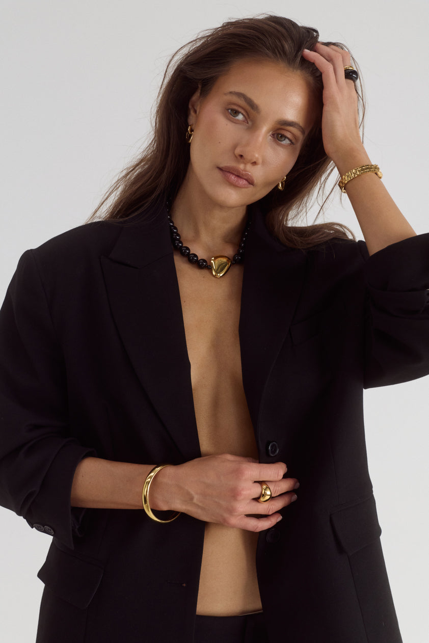 Cendré Plaza black bead necklace worn on a model
