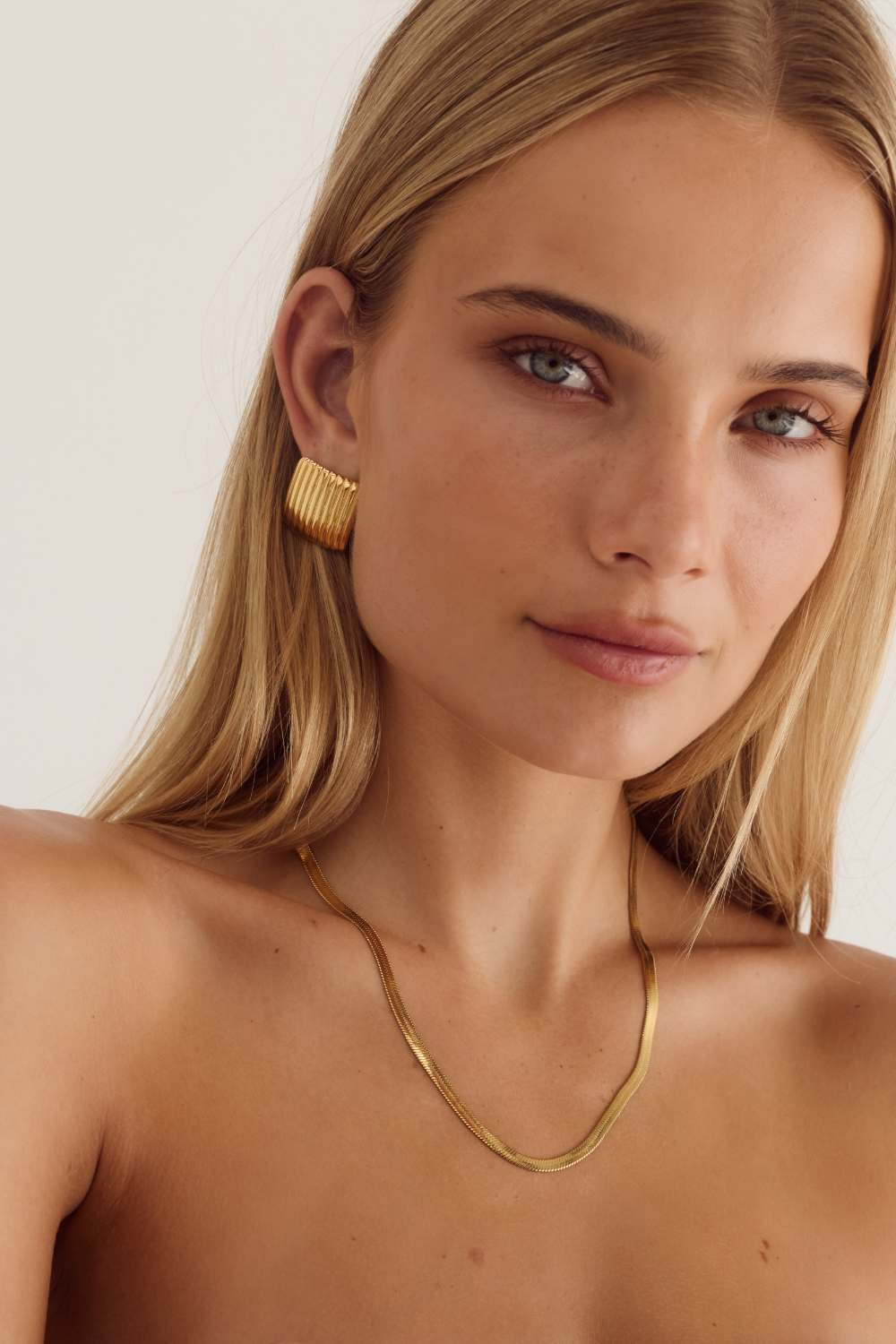Cendré Beau Snake gold necklace styled with layered jewellery