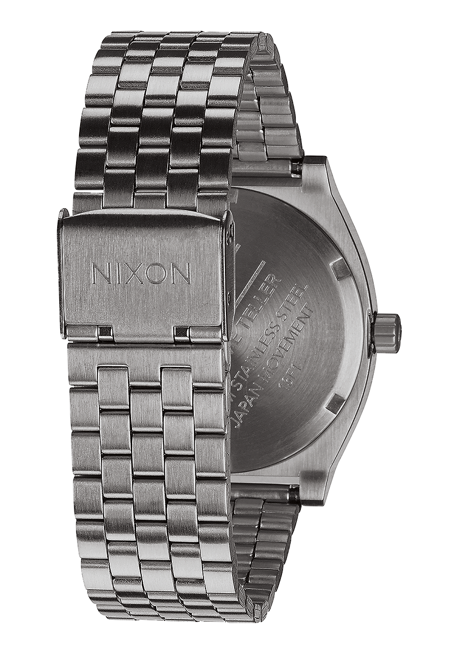 Stainless steel wristwatch with a metal link bracelet and Nixon branding.