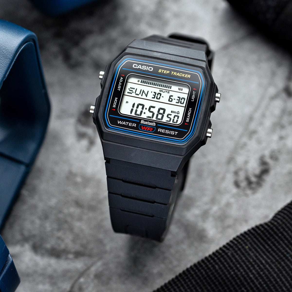 Casio FB100W-1A black resin step tracker watch in a lifestyle setting