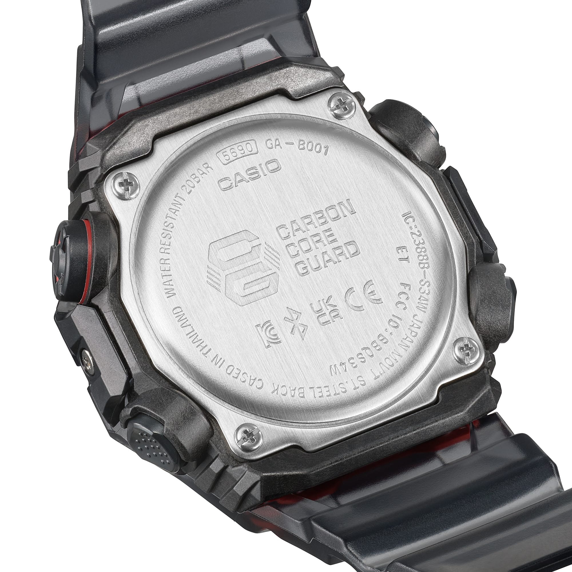 Back of a Casio G-Shock digital watch, showing the metal case back with engraved text and details.