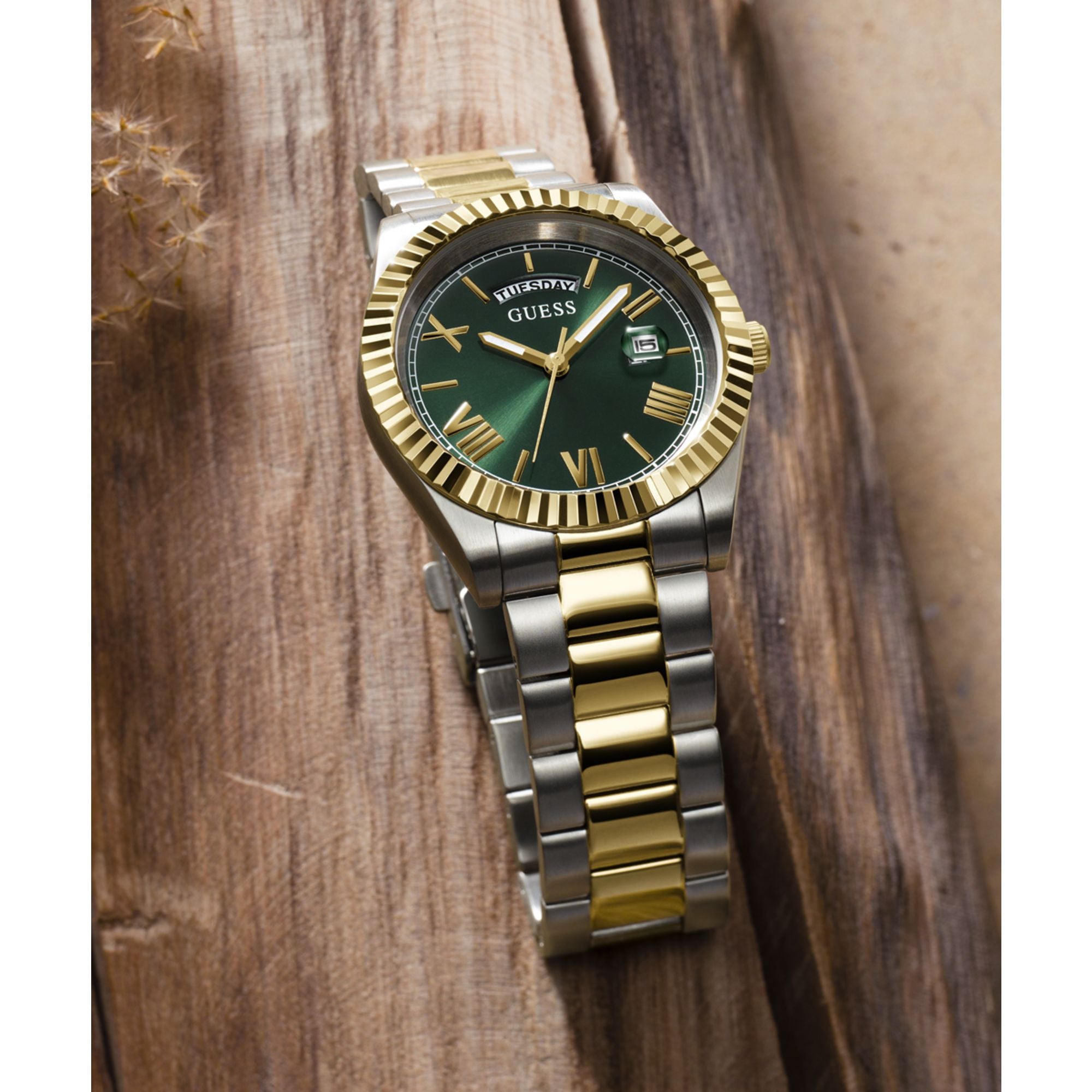 Gold Green Connoisseur Day-Date Watch GW0265G8 by Guess featuring a gold-tone stainless steel case and green dial with Roman numerals.