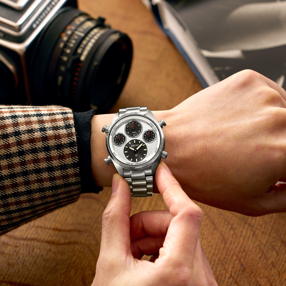 Silver chronograph wristwatch with a metal bracelet and multiple subdials on the face.