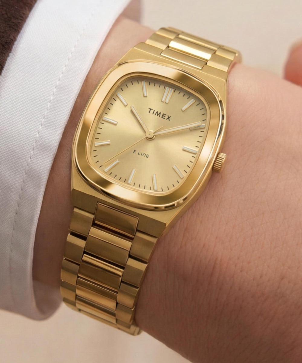 Timex E Line TW6A00900 champagne dial gold-tone bracelet watch worn on the wrist