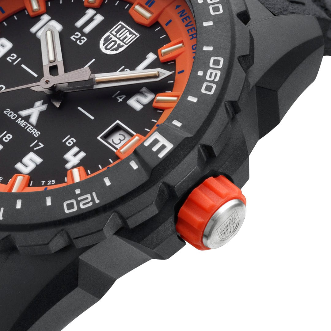Rugged sports watch with a black face, orange accents, and a prominent crown.