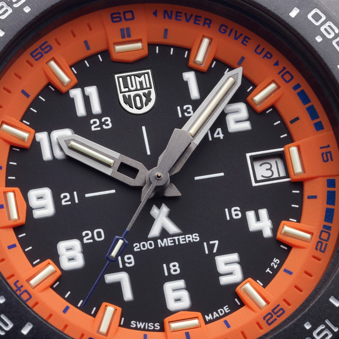 Luminox wristwatch face with black dial and orange bezel.