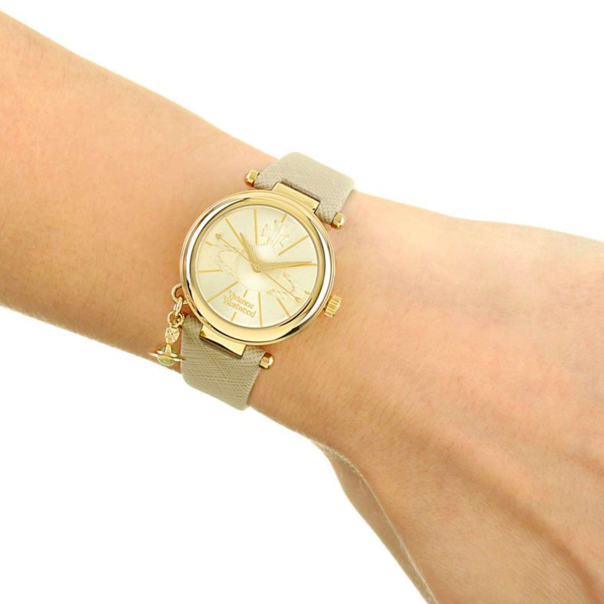 Vivienne Westwood Orb Pop women's watch with a silver dial and cream leather strap. Clasp and case back detail.