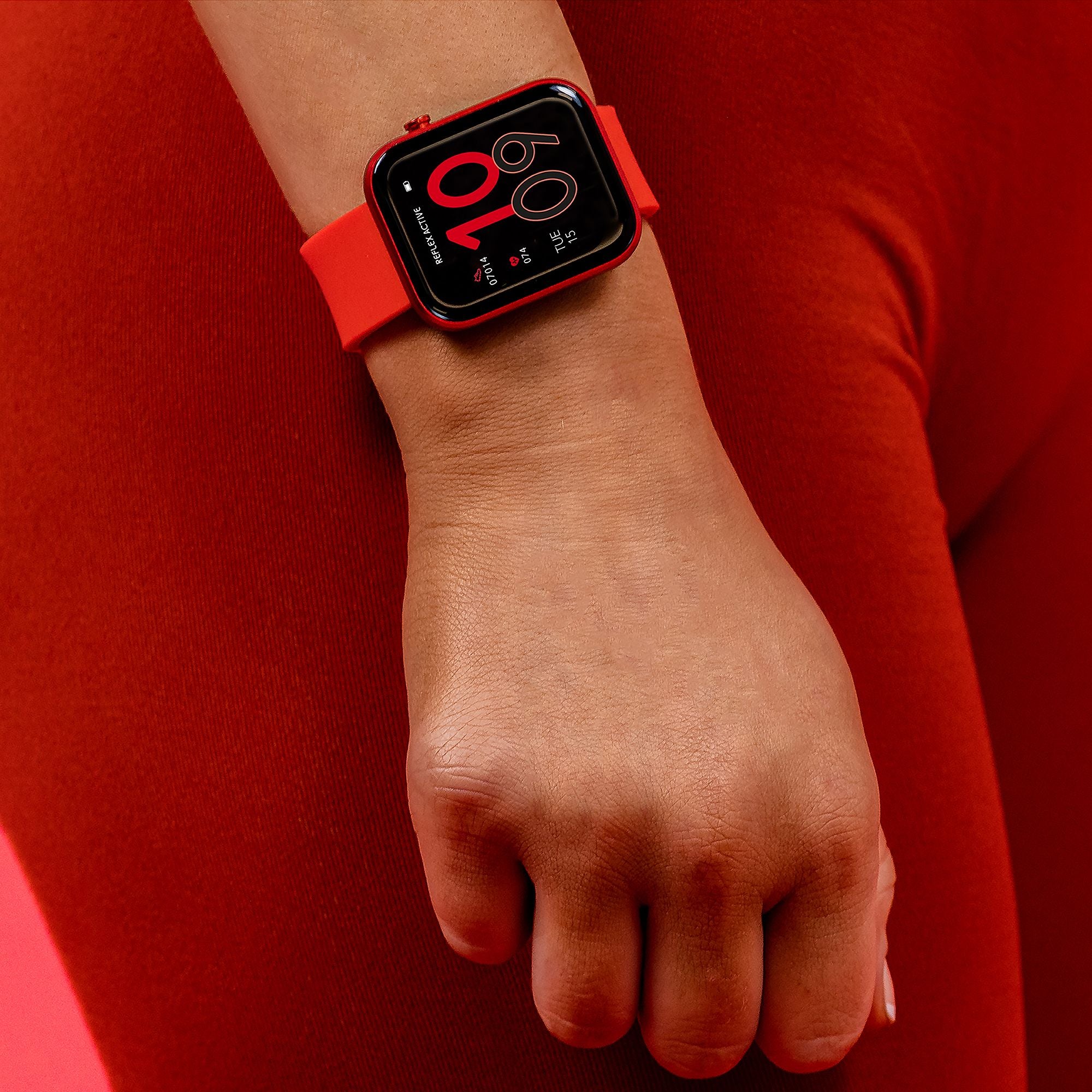 Red Apple Watch with a digital display showing the time 10:09.