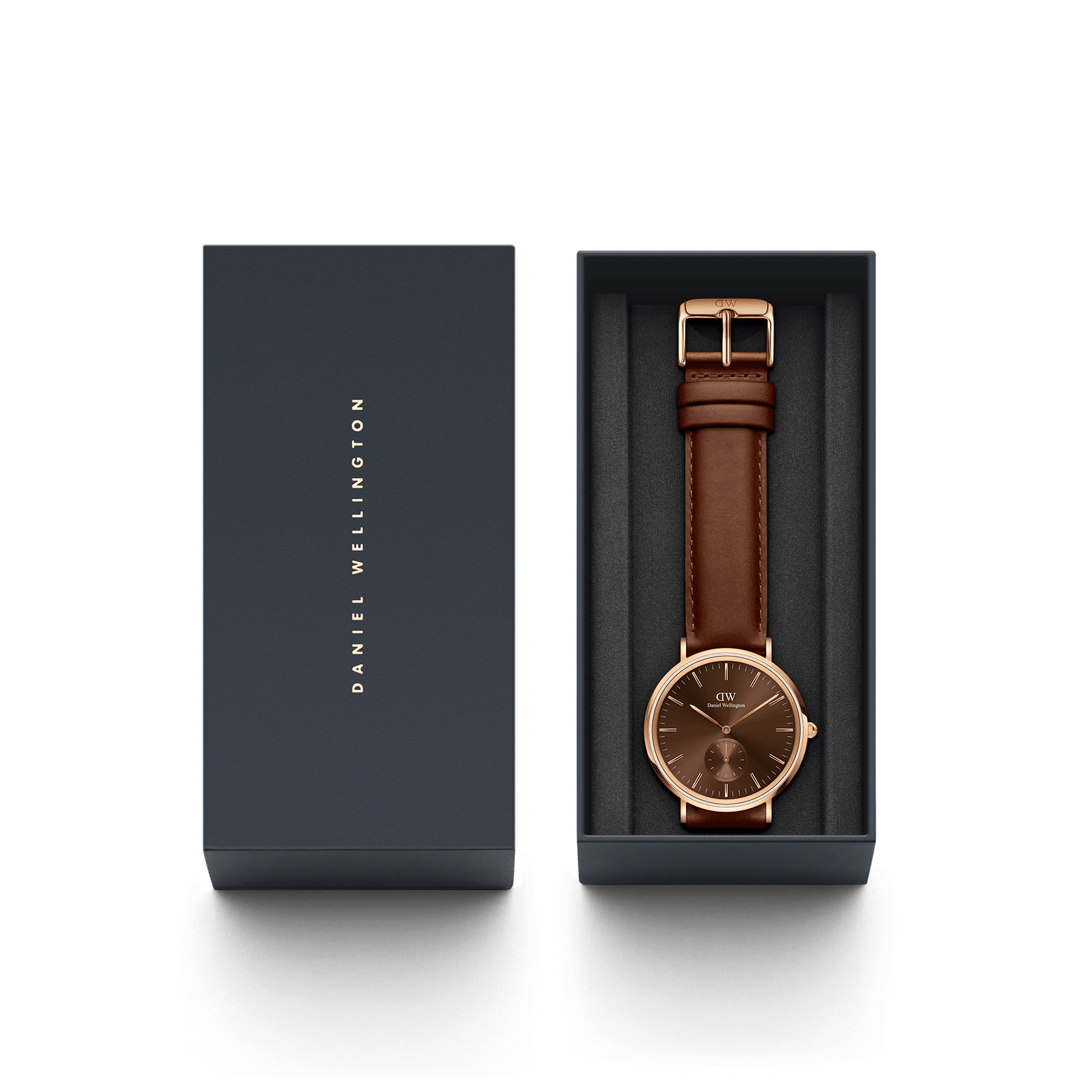 Wristwatch with a brown leather strap and rose gold-toned case in a presentation box.
