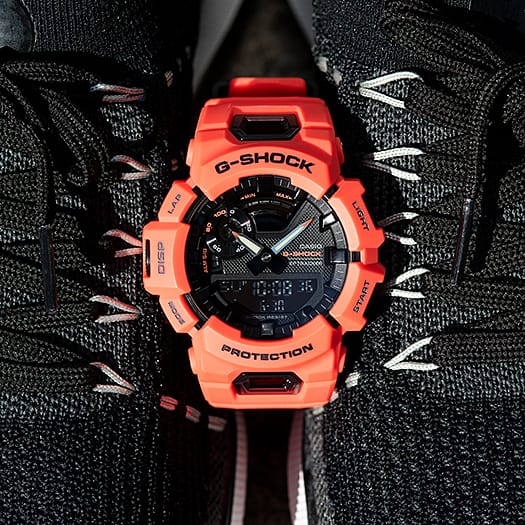 Bright orange G-Shock digital watch with a rugged design.