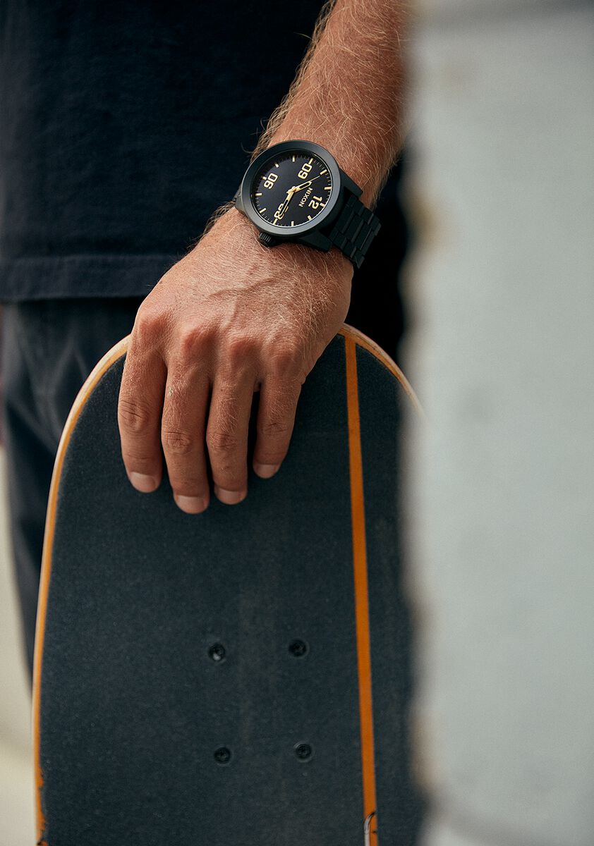 Skateboard with an orange stripe along its edge.