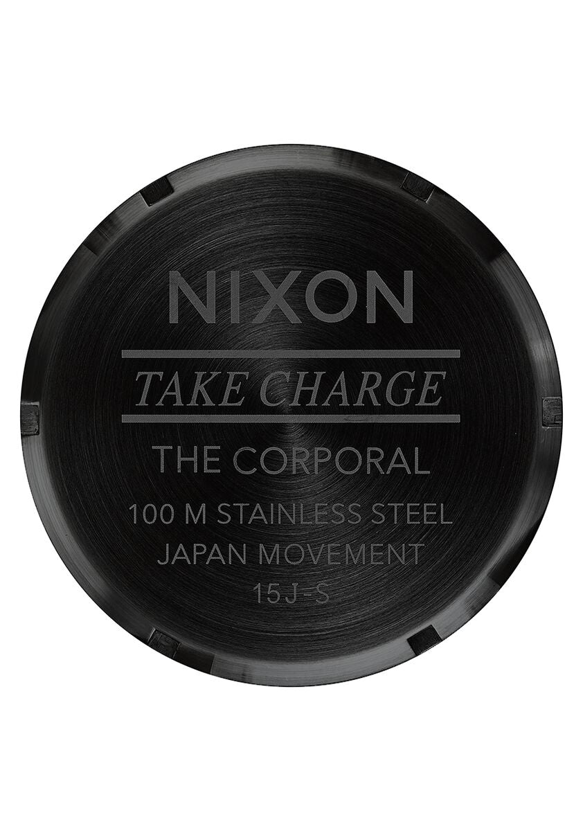 Back of a Nixon watch case engraved with product details.