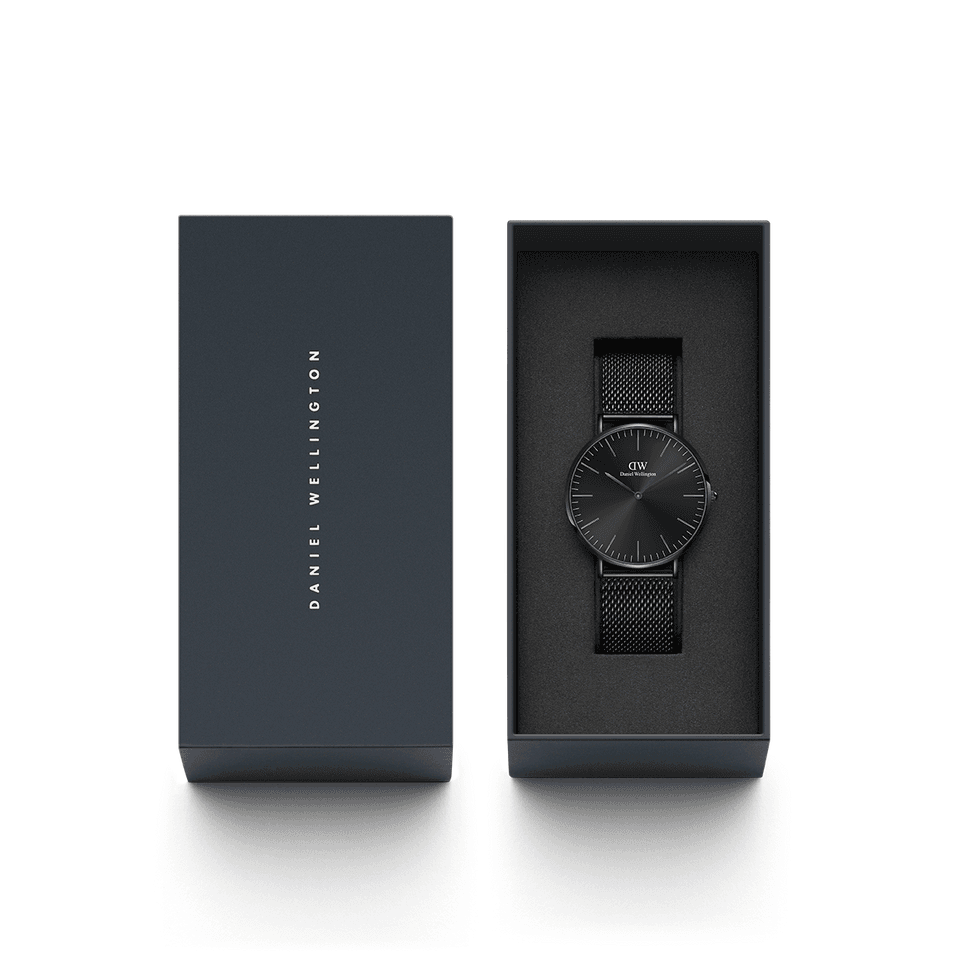 Sleek black wristwatch with a minimalist design in an open gift box.
