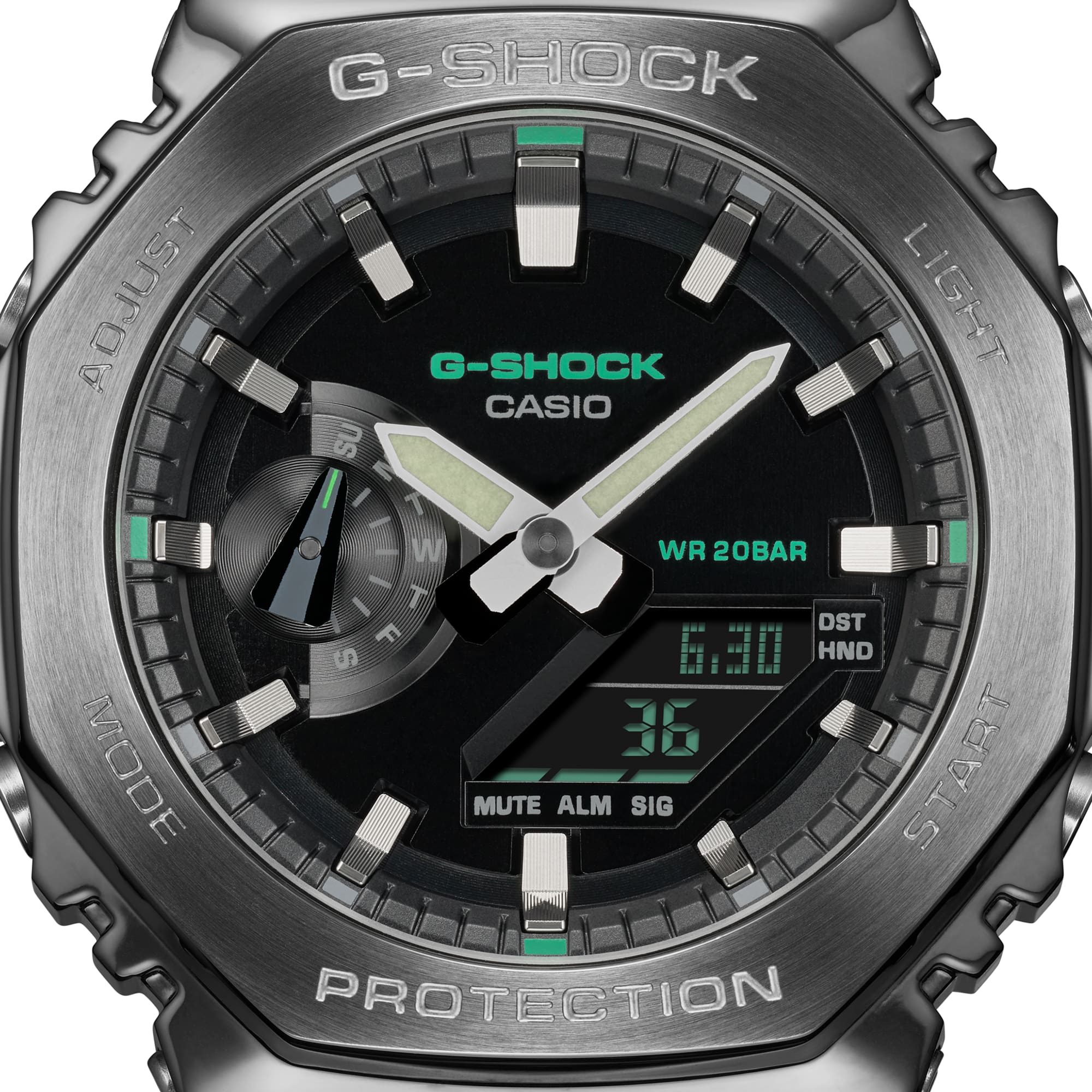 G-Shock watch with a black face, silver hands, and green accents.