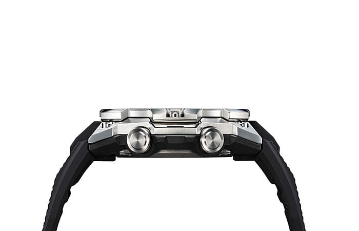Side view of a wristwatch with a black rubber strap and silver-toned case.