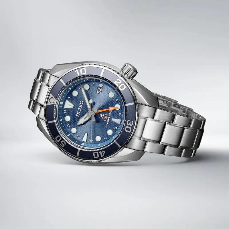 Stainless steel dive watch with a blue dial and rotating bezel.