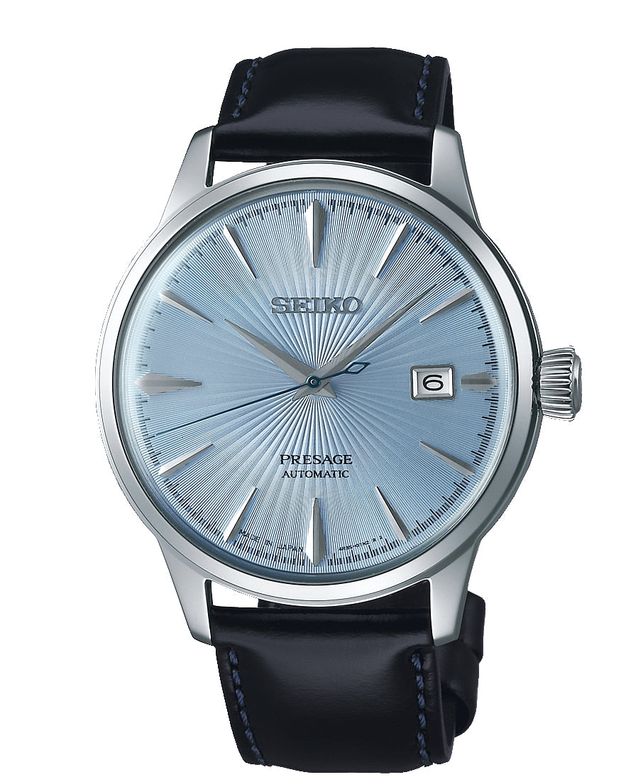 Seiko wristwatch with a light blue dial and black leather strap.