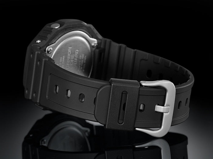 Digital wristwatch with a black resin band and silver buckle.