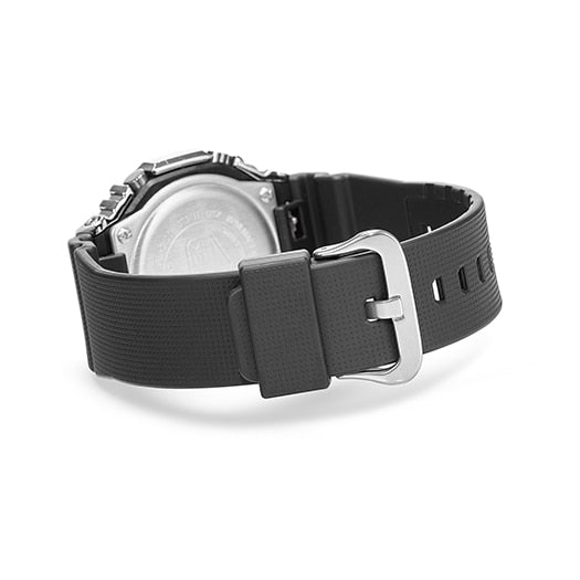Black rubber watch strap with a silver buckle.
