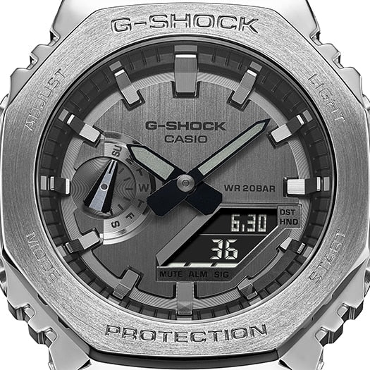 G-Shock watch face with analog and digital displays in a metallic silver casing.