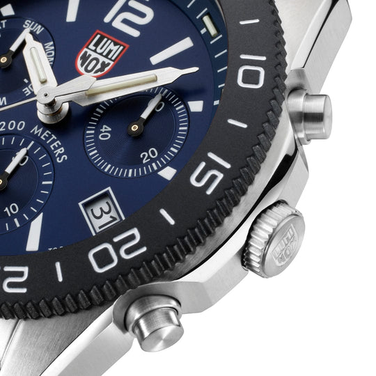 Luxury chronograph wristwatch with a blue dial and silver case.