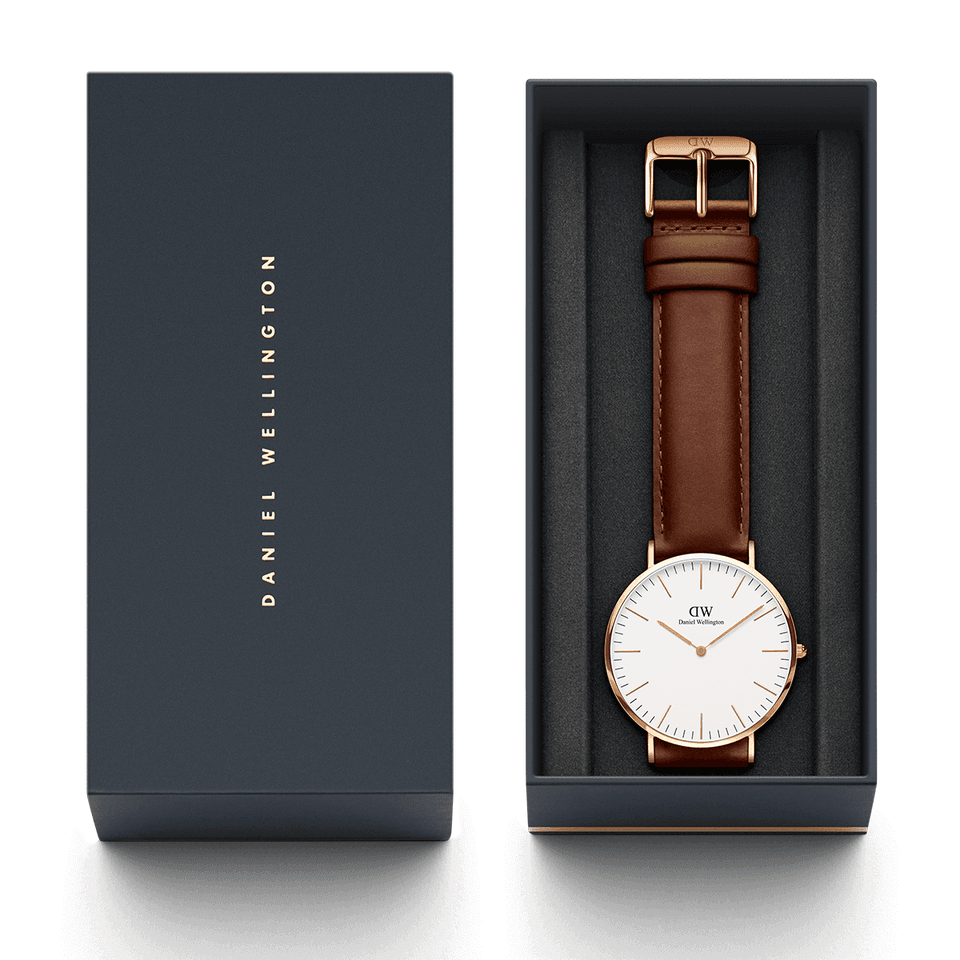 Elegant wristwatch with a brown leather strap and white face in a gift box.