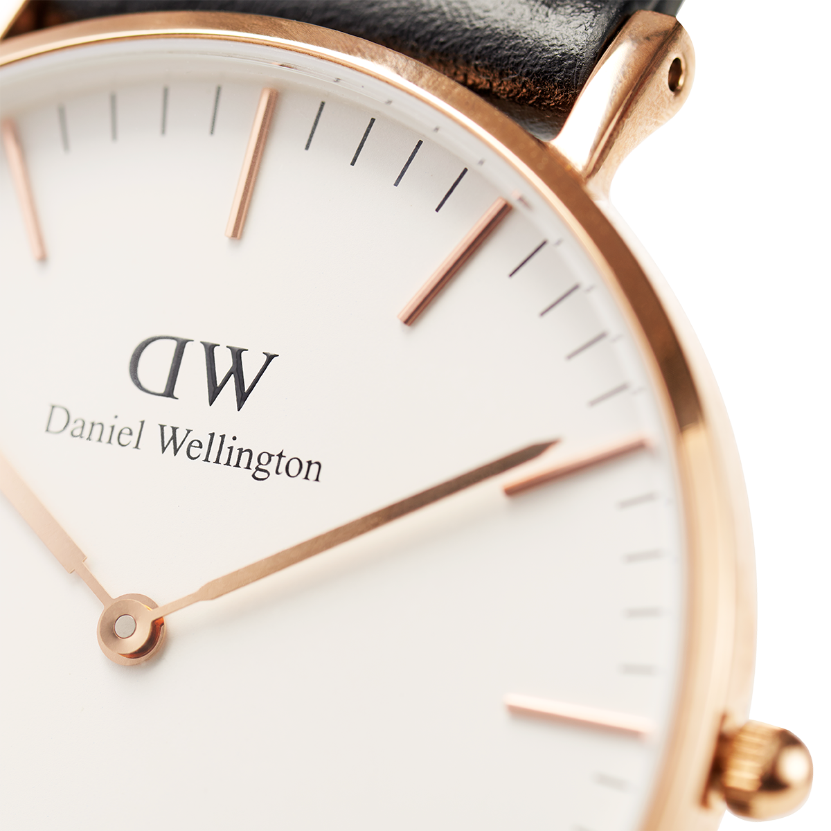 Elegant wristwatch with a rose gold case and white dial displaying the Daniel Wellington brand.