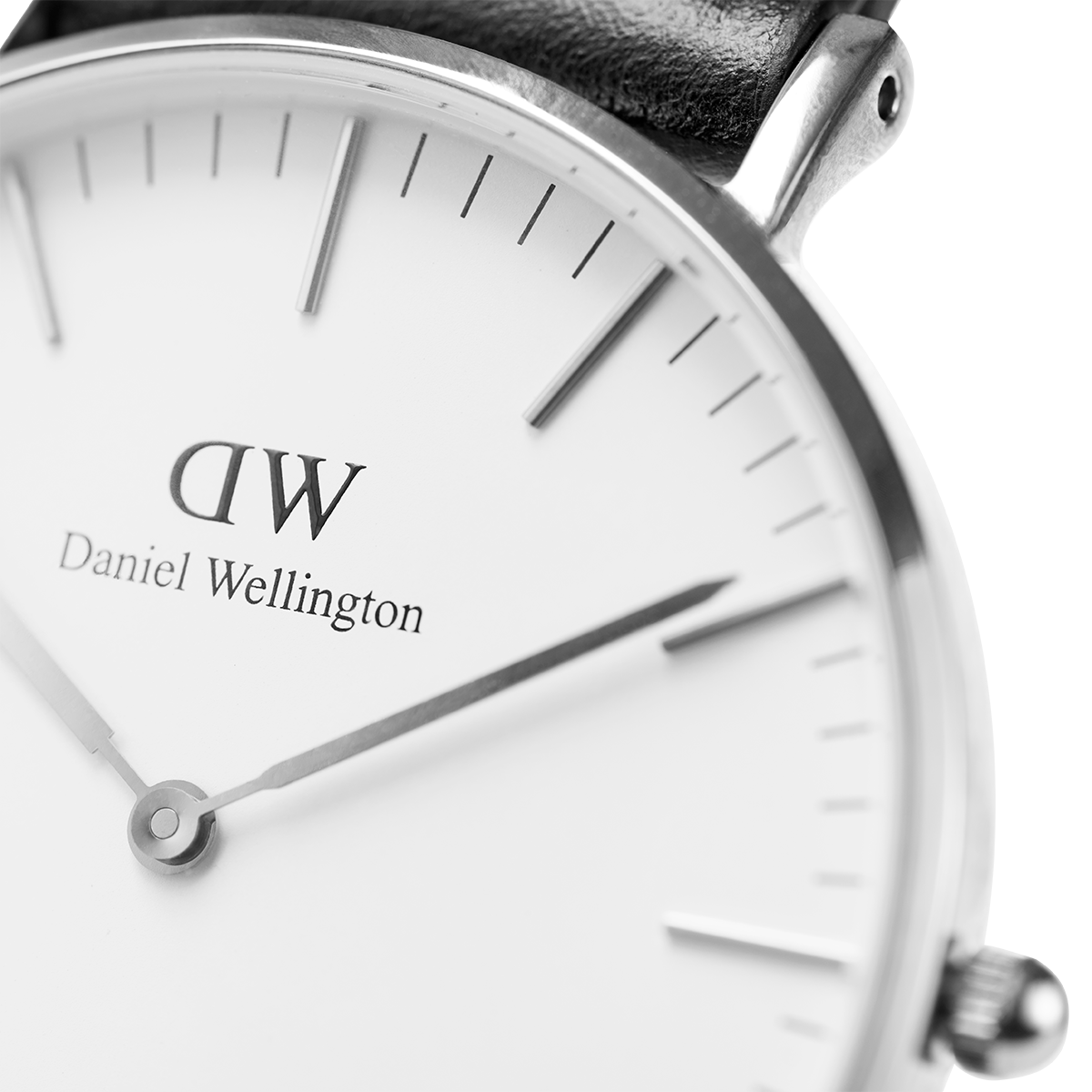 Daniel Wellington wristwatch with a minimalist white dial and black leather strap.
