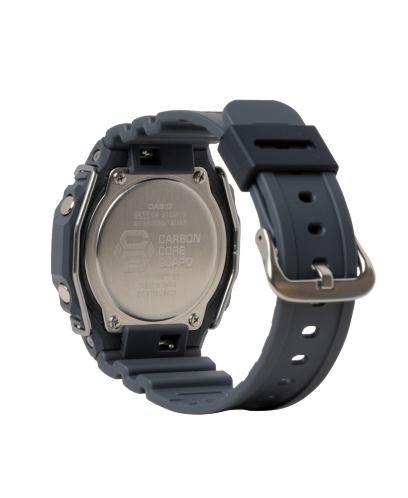 Wristwatch with a black face and strap worn on a person’s wrist.