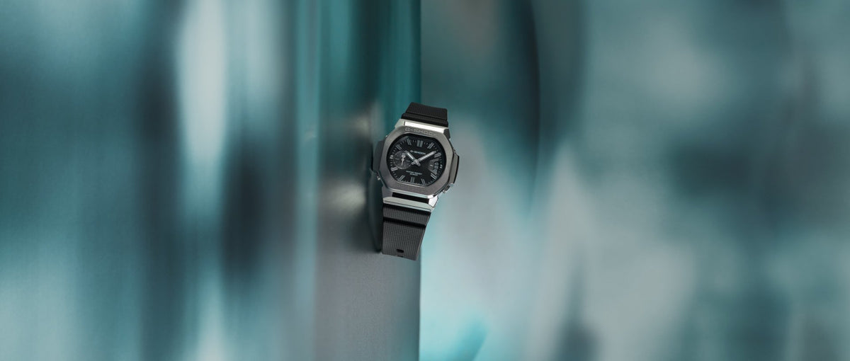 G-SHOCK GMC2500-1A analogue watch on a teal key visual background
