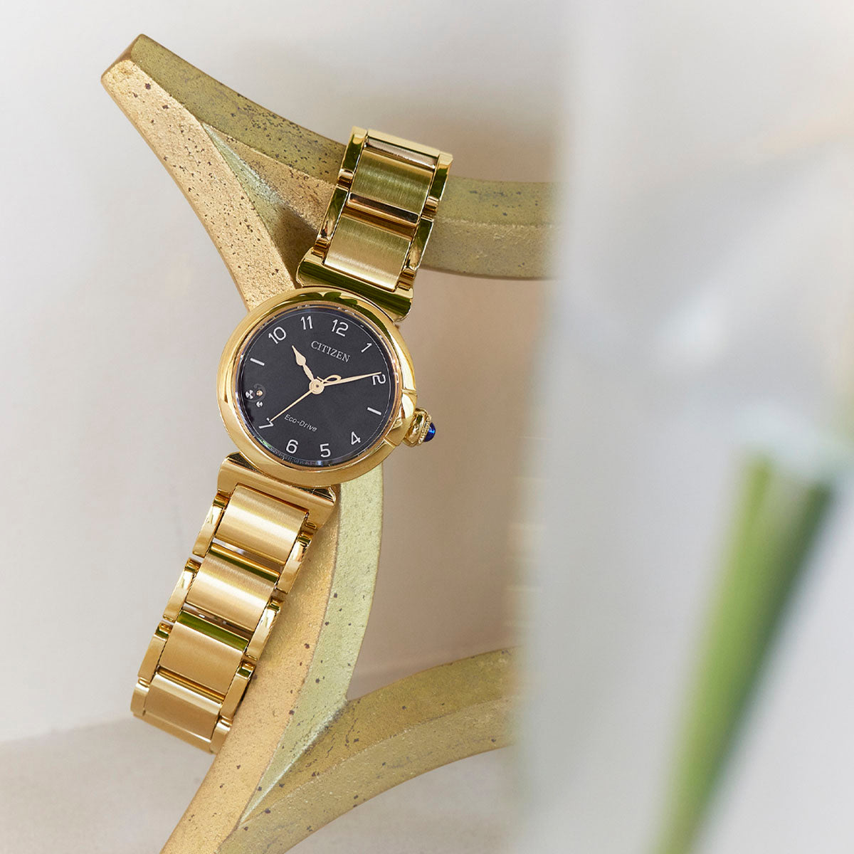 Citizen L May Bells EM1132-88H women's watch black dial gold tone stainless steel bracelet lifestyle view