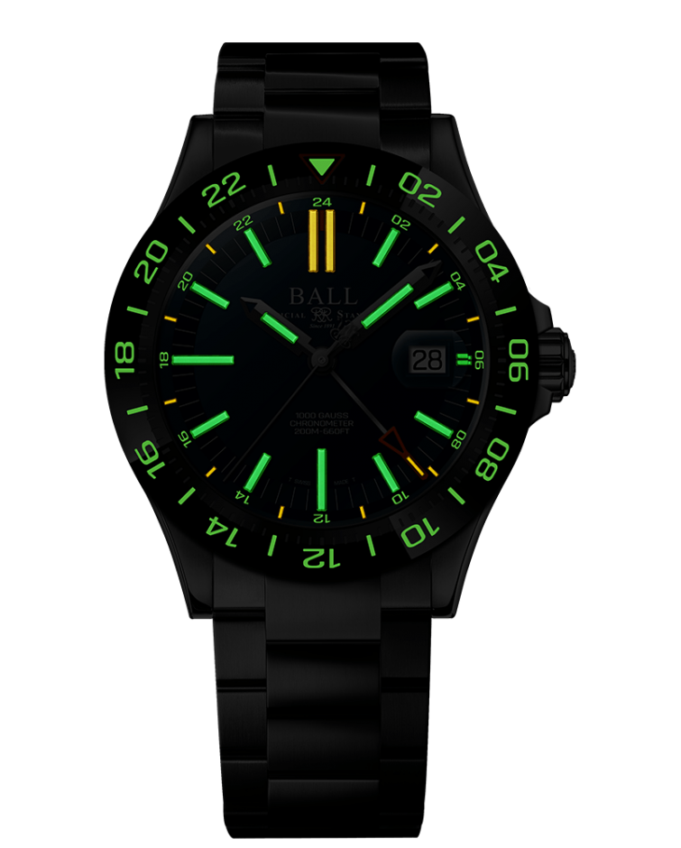 Black wristwatch with luminous green markings and a yellow indicator on the dial.