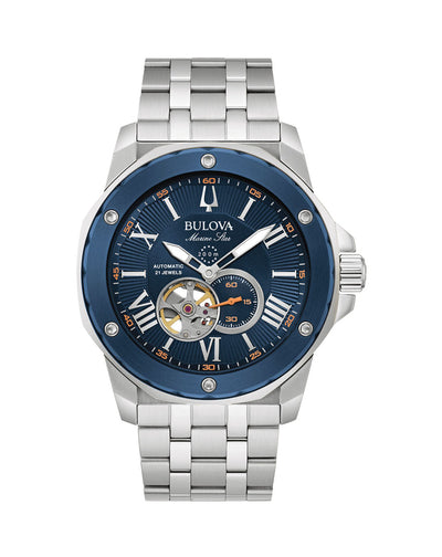 Stainless steel wristwatch with a blue dial and visible mechanical components.