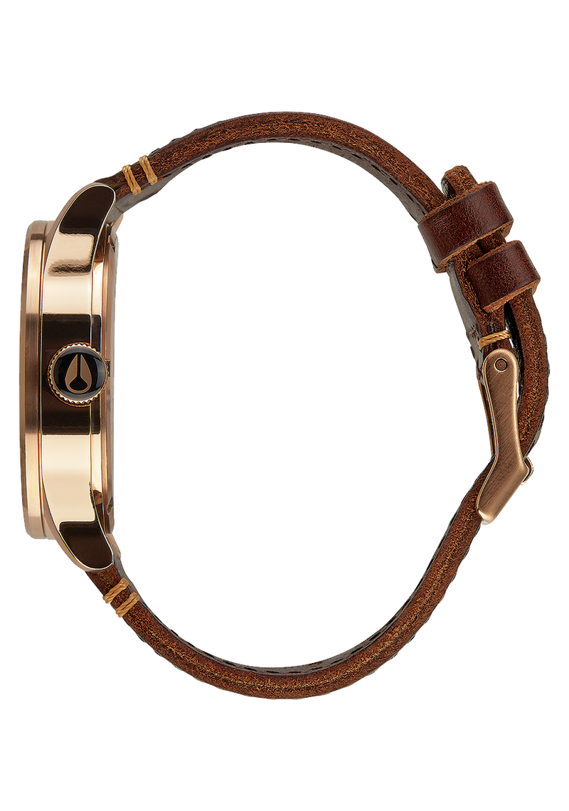 Wristwatch with a brown leather strap and gold-toned case.