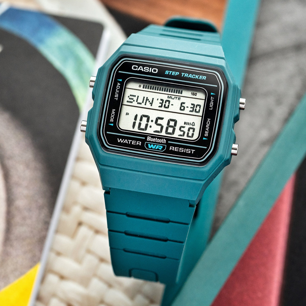 Casio FB100W-3A green resin step tracker watch in a lifestyle setting