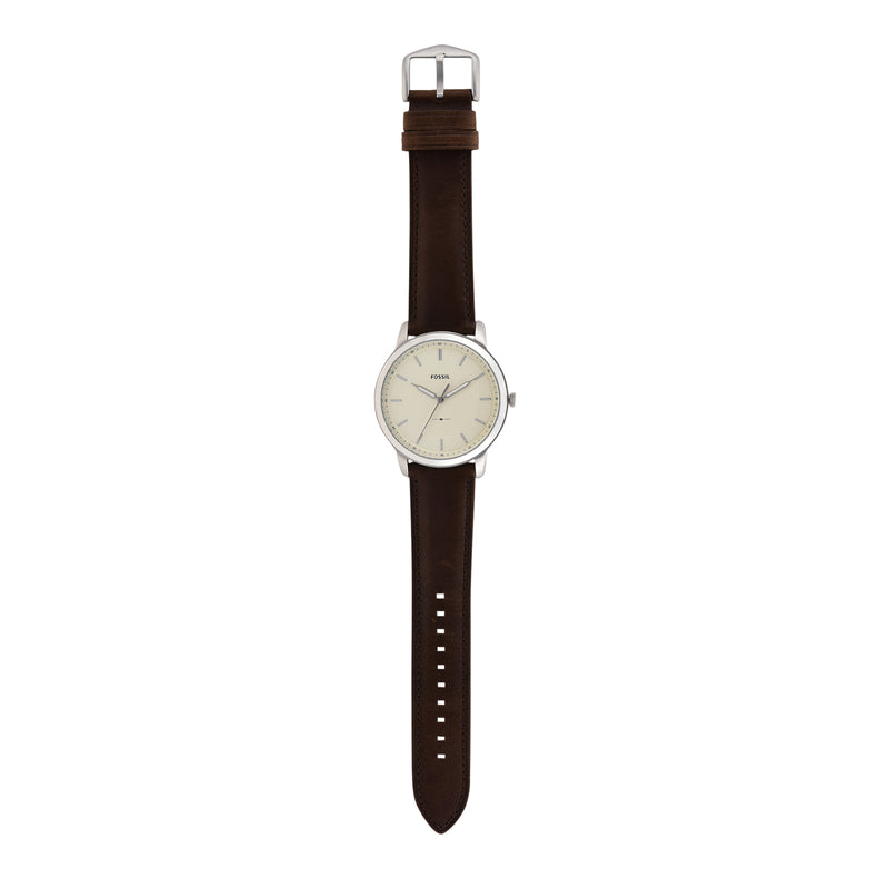 Wristwatch with a brown leather strap and silver-toned round face.