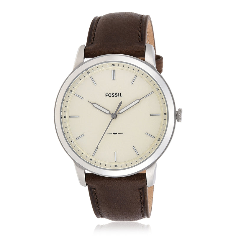 Fossil wristwatch with a brown leather strap and cream-colored dial.