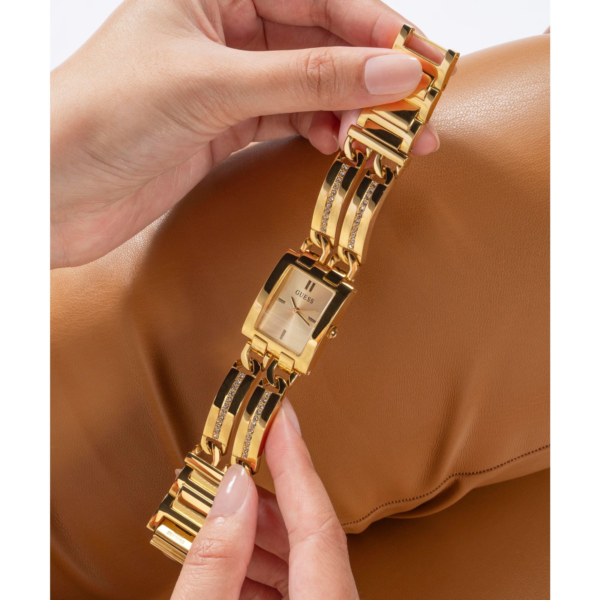 Guess Gold-Tone Square Analog Watch GW0668L2 with a champagne dial and gold-tone bracelet, combining elegance and comfort.