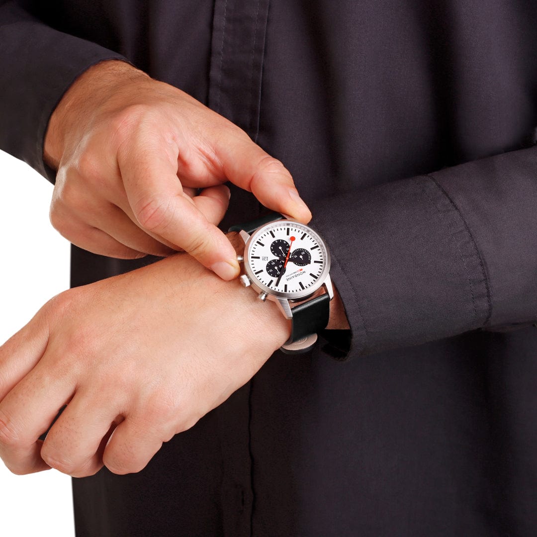 Wristwatch with a unique Mickey Mouse design on its face.
