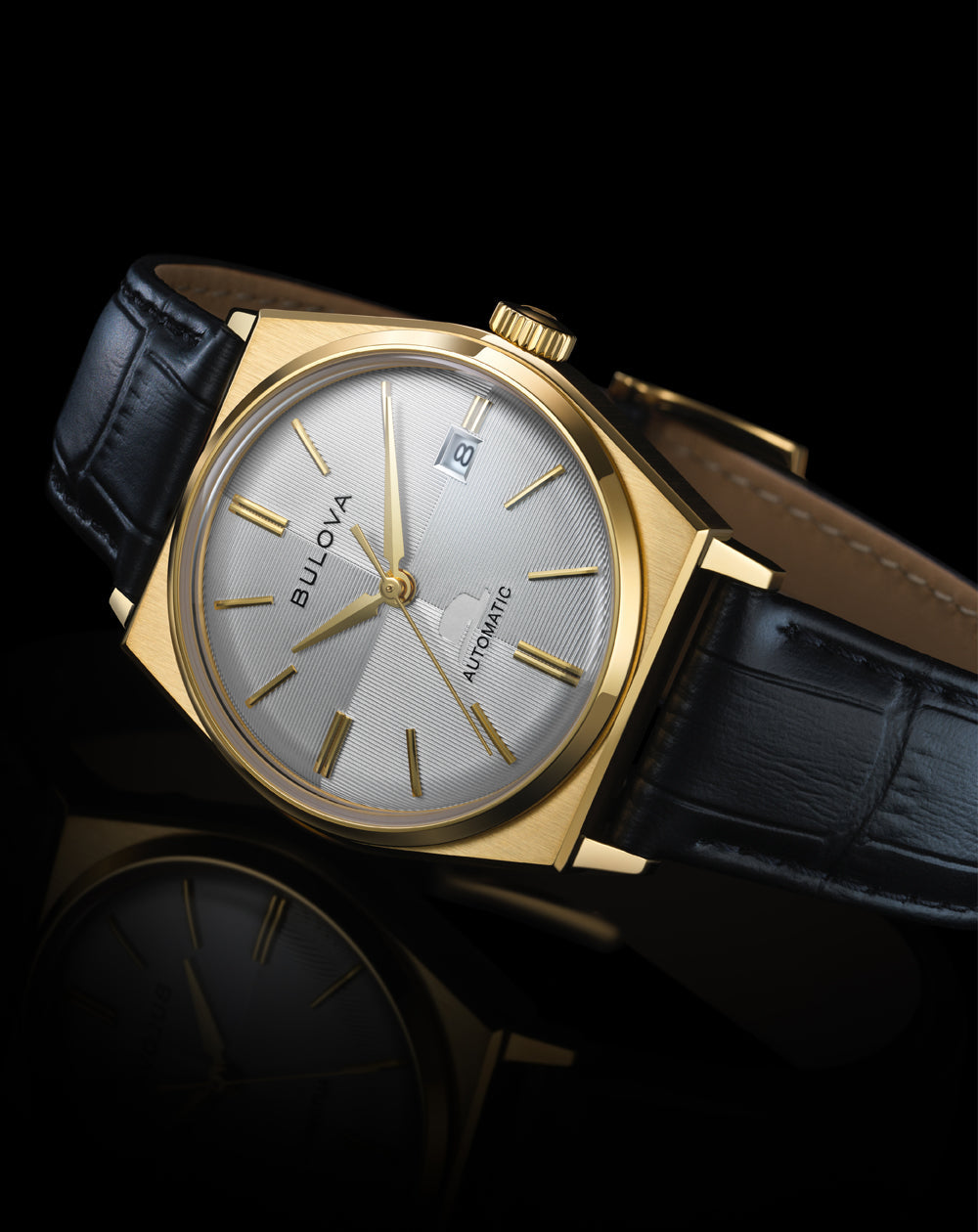 Bulova Frank Sinatra 97B243 gold-tone watch shown in a lifestyle setting.