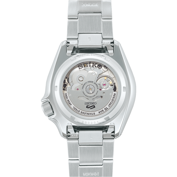 Stainless steel Seiko wristwatch with its back case visible, showing the internal mechanism.