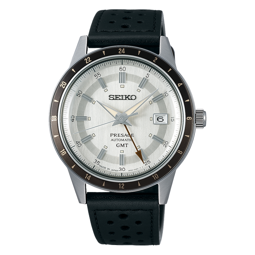 Seiko wristwatch with a white dial, black bezel, and perforated black leather strap.