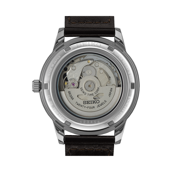 Back of a Seiko automatic watch showing its transparent case and movement mechanism.