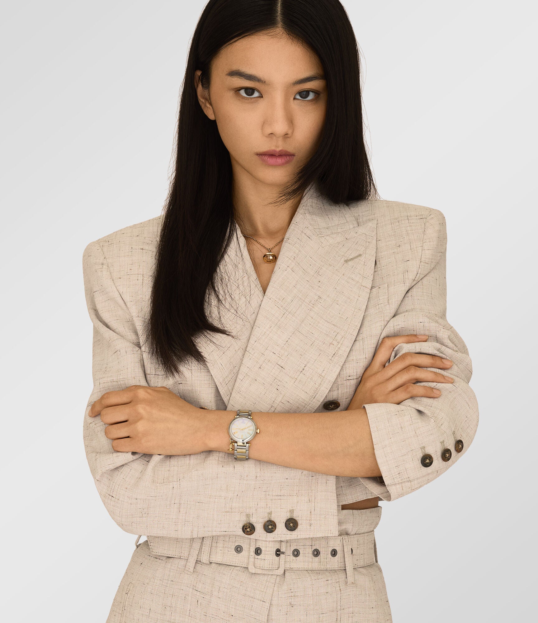 Vivienne Westwood Mother Orb women's watch with a mother of pearl dial and two tone stainless steel bracelet. Shown at an angle.