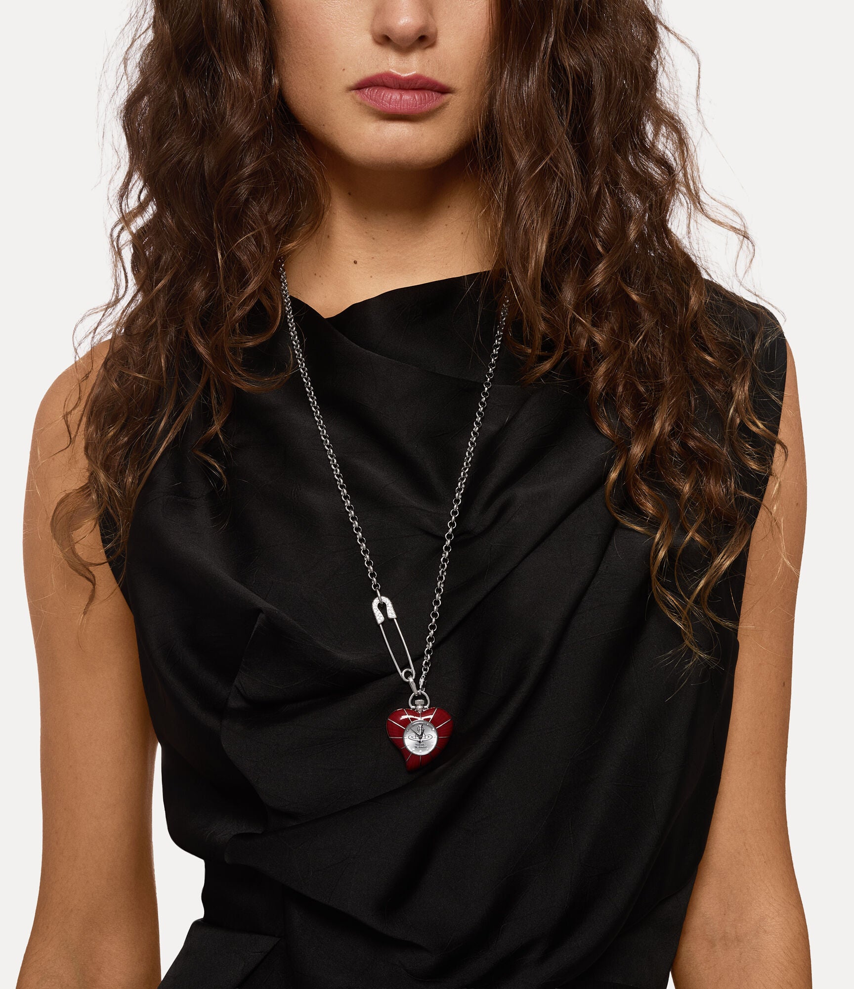 Vivienne Westwood Heart Pendant women's watch with a silver dial and silver pendant chain. Close-up detail view.