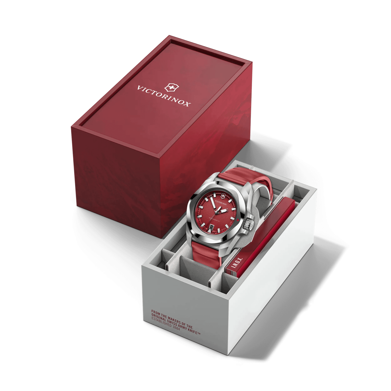 Victorinox Antimagnetic I.N.O.X. Quartz watch with a red grainy dial and red strap in a red and white presentation box.