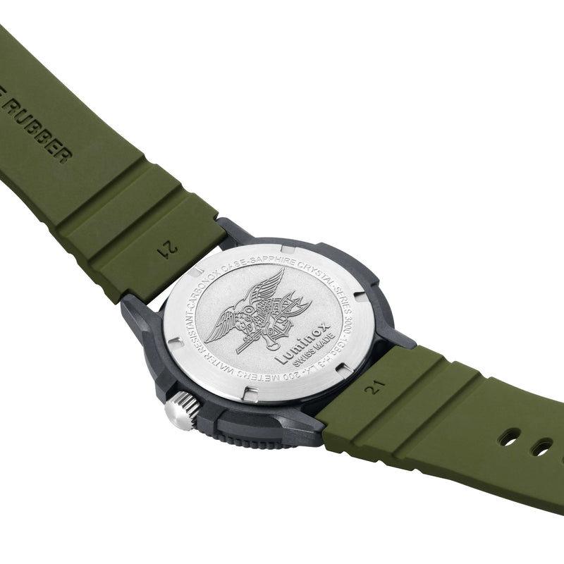 Wristwatch with a green rubber strap and silver-colored back case featuring an eagle design.