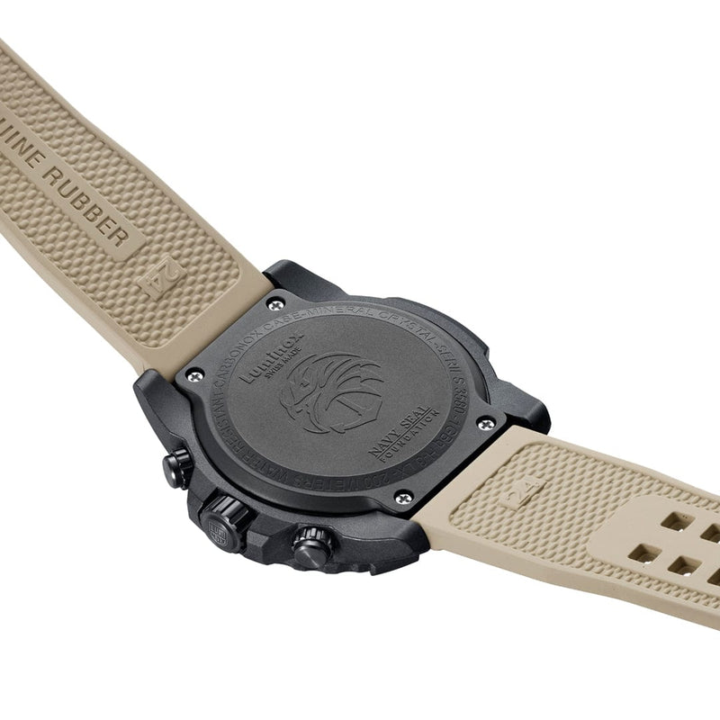 Wristwatch with a black case and beige rubber strap.