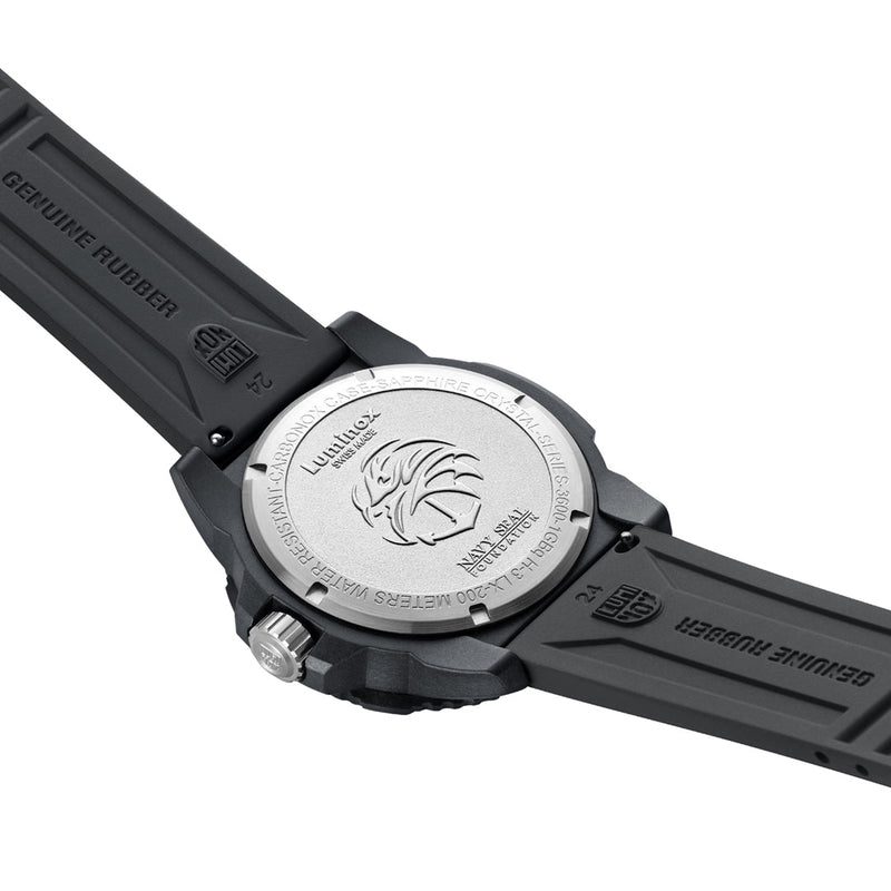 Wristwatch with a black rubber strap and silver-colored caseback displaying an engraved logo.